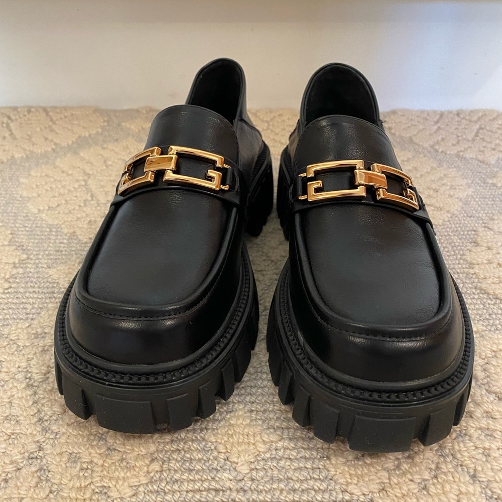 Black chunky leather loafers with gold chain from Lattelier